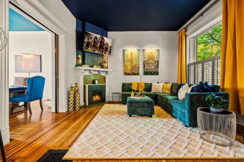 A cozy family room with a plush sectional sofa and a large TV — the perfect spot to chill, unwind, and enjoy movie nights together.